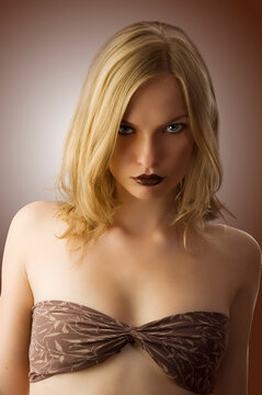 fashion portrait of pretty sensual blond looking in camera angry