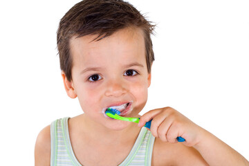 Little boy brushing his teeth - isolated, closeup