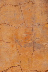 detail of yellow brown wall in bad condition