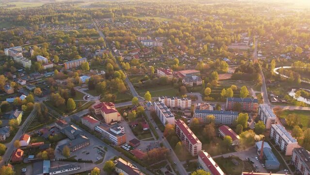 A small border town in Latvia. Valka city at sunset. Drone flight over the city