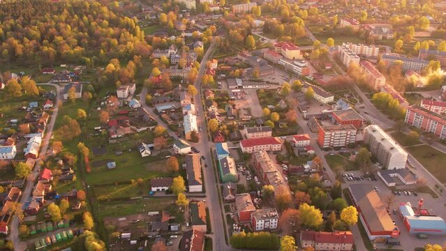 A small border town in Latvia. Valka city at sunset. Drone flight over the city