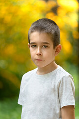 Boy looking at camera, colorful background