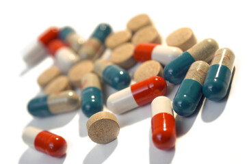Tablets and pills isolated on the white background