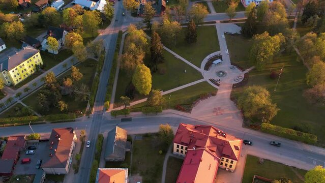 A small border town in Latvia. Valka city at sunset. Drone flight over the city