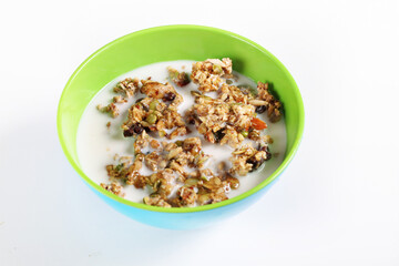 granola cereal with milk on white