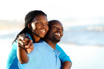 Attractive couple having fun together at the beach