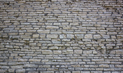 Old brickwork wall. Ancient masonry wall. Antique masonry wall.