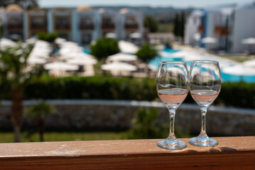 glasses of champagne on table balcony hotel summer holidays vacation relax greece alcohol drinks...