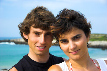 Portrait of a beautiful young couple on the beach