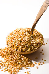 yellow peas (cereals) in the bowl with over white