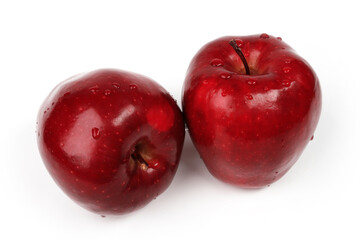 Two fresh red apples with drops