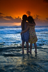 Fototapeta na wymiar two girls in the beach at sunset