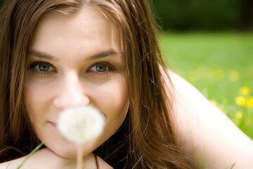 The Girl Looking On White Dandelion