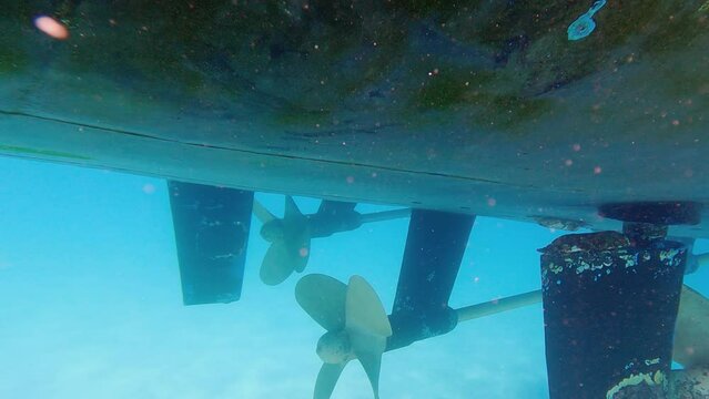 Underwater view of engine speedboat propeller parked in the sea