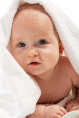 Attractive baby covered with white towel