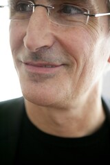 macro crop portrait of senior businessman with glasses