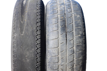 old worn out tire next to another old tire isolated on white background
