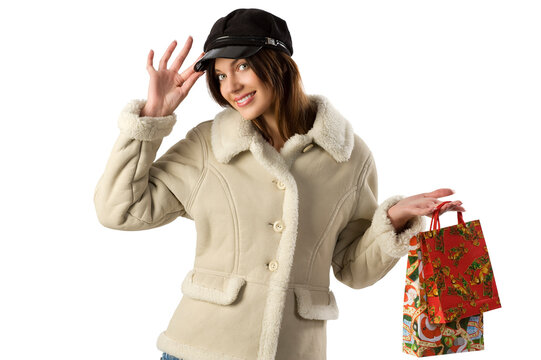 beautiful girl in winter dress making christmas shopping with a nice black hat