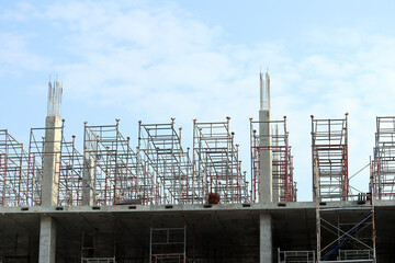 building structure under construction and steel scaffolding.