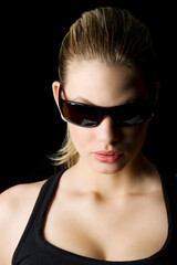 Fototapeta premium glamor portrait of a blond mistery woman with sunglasses looking down