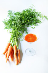 organic fresh carrot juice on white