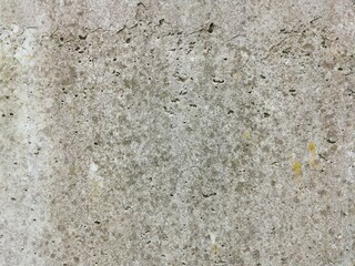 The grunge texture is an old gray concrete wall.