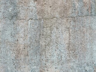 The grunge texture is an old gray concrete wall.