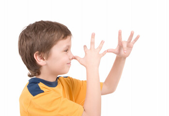 Young boy smiling isolated on white