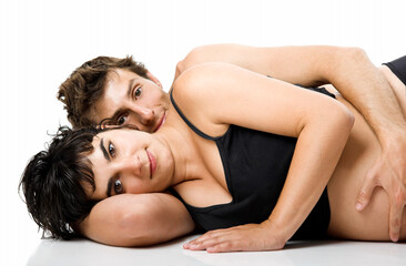 Obraz premium Beautiful couple in love expecting a baby - Isolated on white