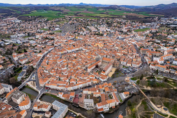 Aerial above the old town of Issoire in France on a sunny day in early spring.