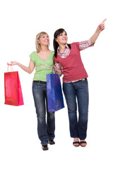 Fototapeta premium two attractive women with shopping bags. over white background