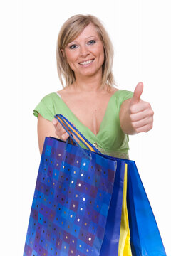 casual woman with shopping bags. over white background