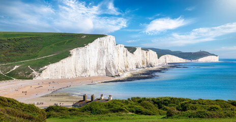 Panorama of the impressive Seven Sisters Chalk cliffs during a eraly summer day, Seaford, East Sussex, England - obrazy, fototapety, plakaty