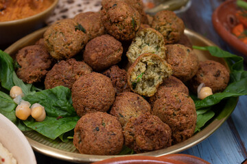 Falafel on plate as part of a larger mezze table