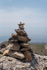 stack of stones on top of the mountain dikeos kos island greece Mediterranean landscape view hiking 