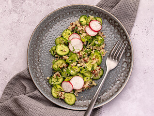 Food photography of salad; cucumber, radish, onion, dill, bulgur, quinoa, vegetable; leaf; organic; ingredient; vitamin; diet
