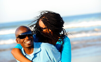 Happy African American couple enjoy the beach