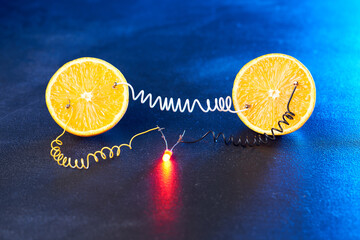 Free energy electricity generator using oranges in blue light.