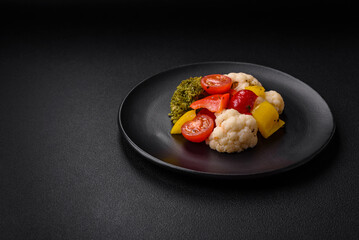 Delicious fresh salad of broccoli, cauliflower, sweet peppers and cherry tomatoes