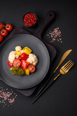 Delicious fresh salad of broccoli, cauliflower, sweet peppers and cherry tomatoes