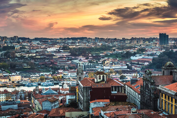 Obraz premium Sunset over Porto city, Portugal. View bell tower of Clerigos Churc