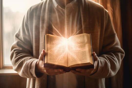 Man is holding and hugging the bible on his chest with atmosphere light