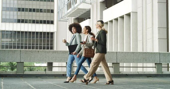 Team, friends and business women walking in the city on their morning commute into work. Collaboration, corporate and professional partnership with an employee group taking a walk in an urban town