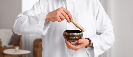 Reiki master with Tibetan singing bowl