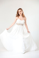 young girl in a white dress on a white background