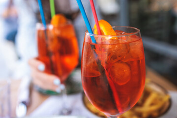 Orange red colored aperitif alcohol cocktails on a party, beautiful view of alcohol setting on...