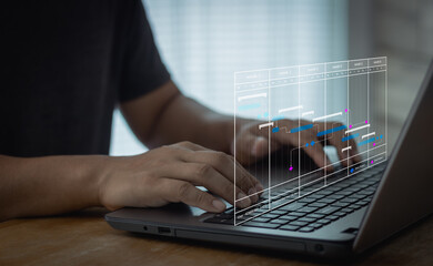 Business online schedule on virtual screen of computer. Project management concept with gantt chart. Business people check schedule planning and Implementation, work progress, efficient scheduling.