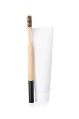 Black bamboo toothbrush and paste on white background