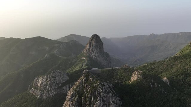 Aerial video of the La Gomera landscape with Roque Agando seen at sunrise golden hour
