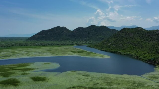 Aerial view of beautiful Skadar Lake between mountains at summer, Montenegro, 4k